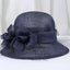 Dark Blue Sinamay derby hat with floral decoration and soft veil