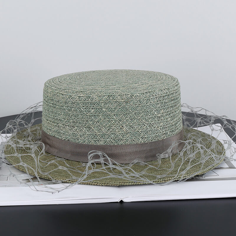 Light avocado green raffia straw bucket hat side view