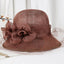 Light brown Sinamay summer derby hat with flower accents and veil