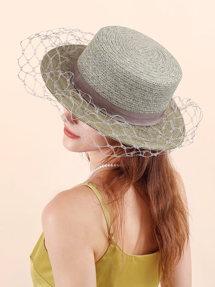 Light avocado green raffia straw bucket hat side view
