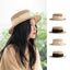 Model wearing beige boater hat with sheer black band – summer outfit