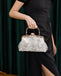 Model holding the clutch in hand at a formal event setting