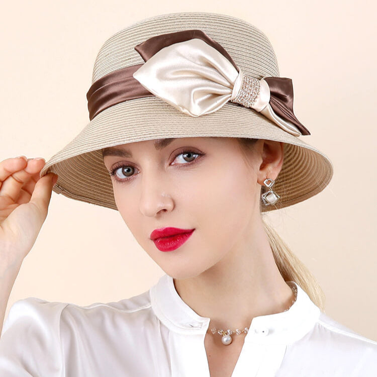 Lightweight straw-like women’s hat with champagne coffee ribbon