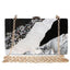 Clutch aus Acryl in Schwarz-Weiß-Ton mit Perlglanz-Glitzer und Marmor-Effekt