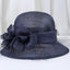Dark Blue Sinamay derby hat with floral decoration and soft veil