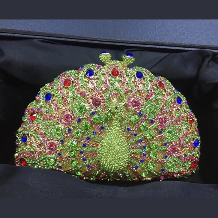 Luxuriöse Clutch mit Strasssteinen und Pfauenmotiv
