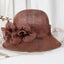 Light brown Sinamay summer derby hat with flower accents and veil