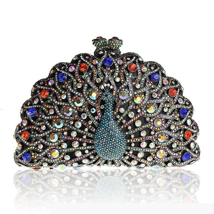 Luxuriöse Clutch mit Strasssteinen und Pfauenmotiv