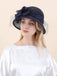 dark blue derby hat with floral detail and veil on model

